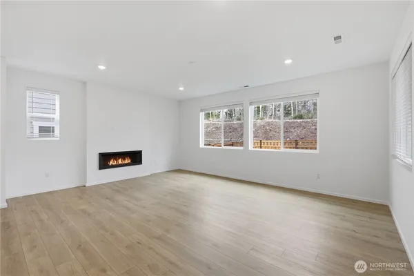a view of entryway with wooden floor and stairs