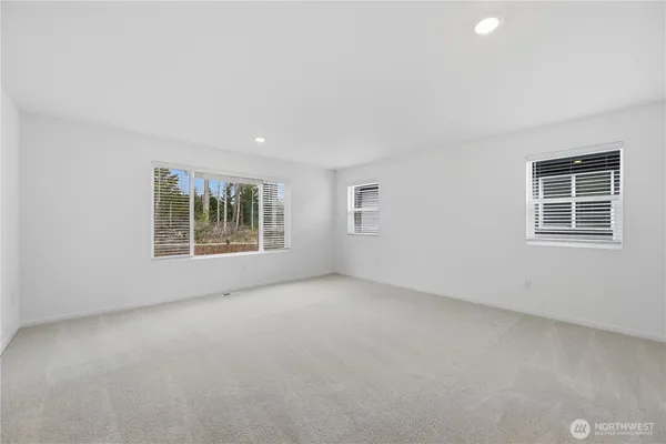 a bathroom with double sink and a mirror