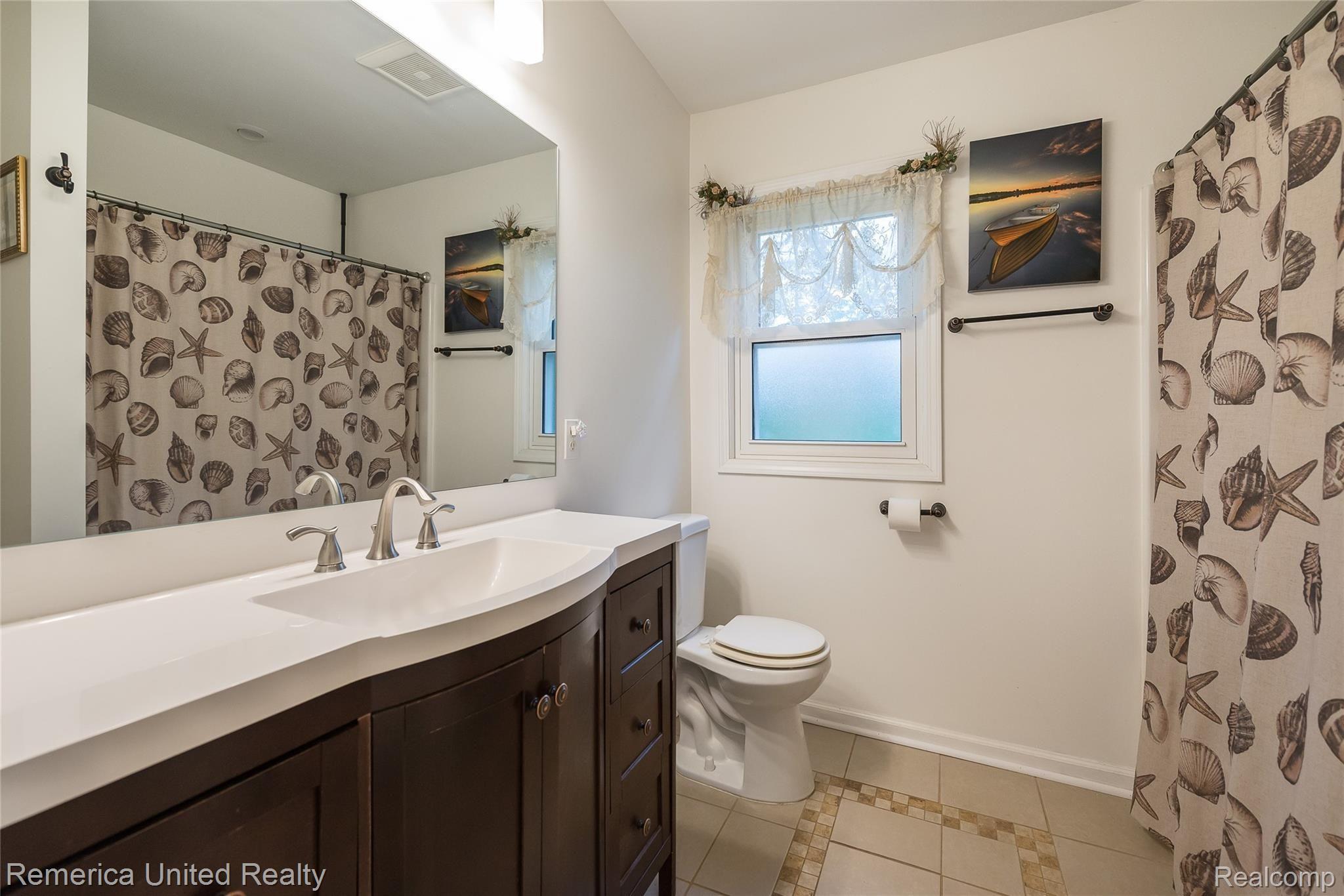 3447 Rush Lake Road Pinckney, MI 48169 - Photo 14 of 42 First Floor Bath with Ceramic Tile, new vanity, and shower