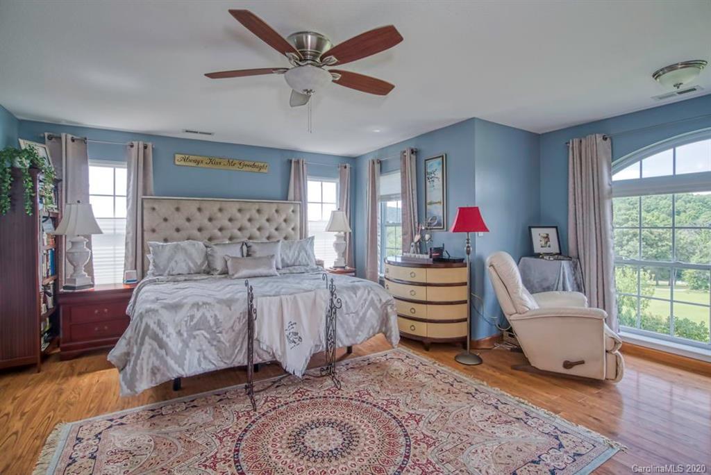 126 Barkers Grove Road Union Grove, NC 28689 - Photo 11 of 48 a bed room with a bed and a couch
