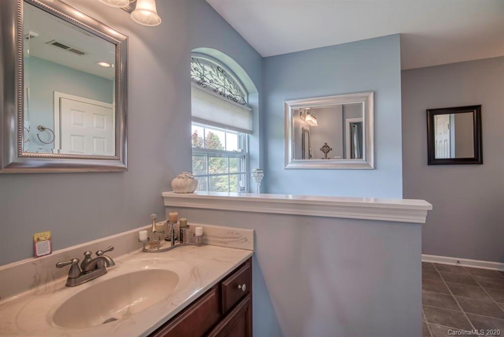 126 Barkers Grove Road Union Grove, NC 28689 - Photo 13 of 48 a bathroom with a sink and a mirror