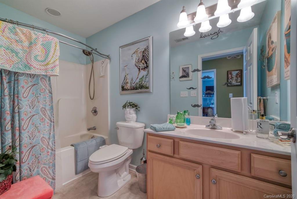 126 Barkers Grove Road Union Grove, NC 28689 - Photo 17 of 48 a bathroom with a granite countertop toilet sink and mirror