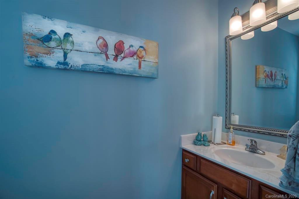126 Barkers Grove Road Union Grove, NC 28689 - Photo 19 of 48 a bathroom with a sink a mirror and vanity