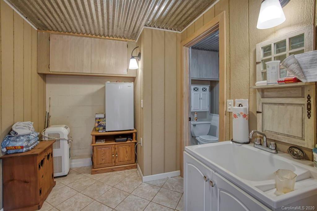 126 Barkers Grove Road Union Grove, NC 28689 - Photo 33 of 48 a bathroom with a sink and a mirror