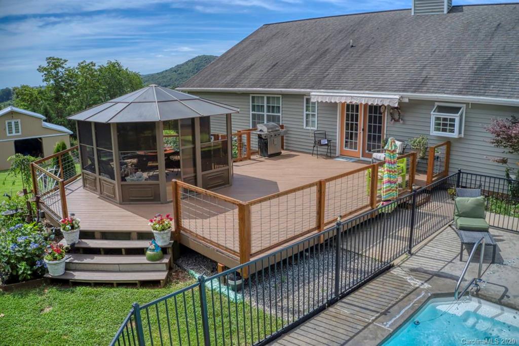126 Barkers Grove Road Union Grove, NC 28689 - Photo 40 of 48 a view of a house with wooden deck and furniture