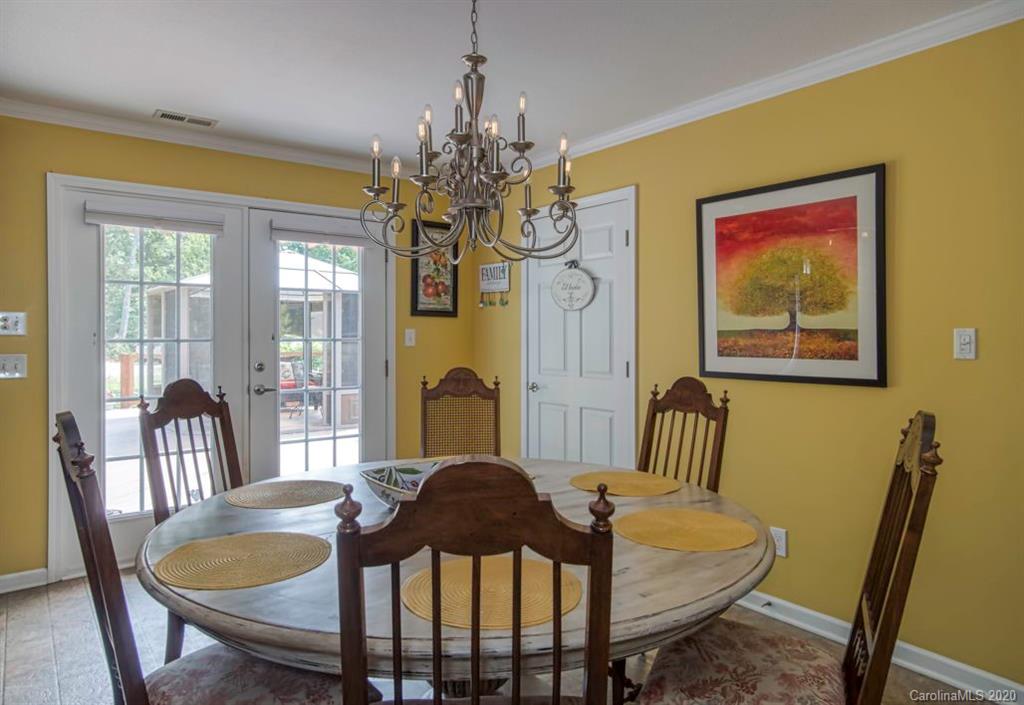126 Barkers Grove Road Union Grove, NC 28689 - Photo 7 of 48 a view of a dining room with furniture and chandelier