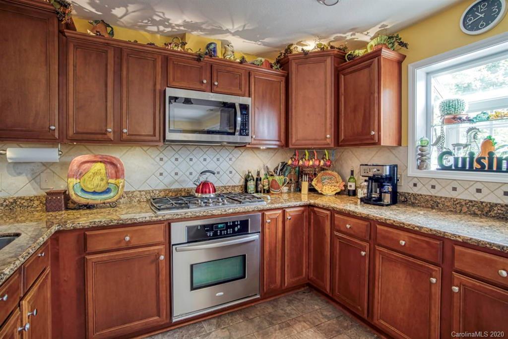 126 Barkers Grove Road Union Grove, NC 28689 - Photo 10 of 48 a kitchen with granite countertop a sink stainless steel appliances and cabinets