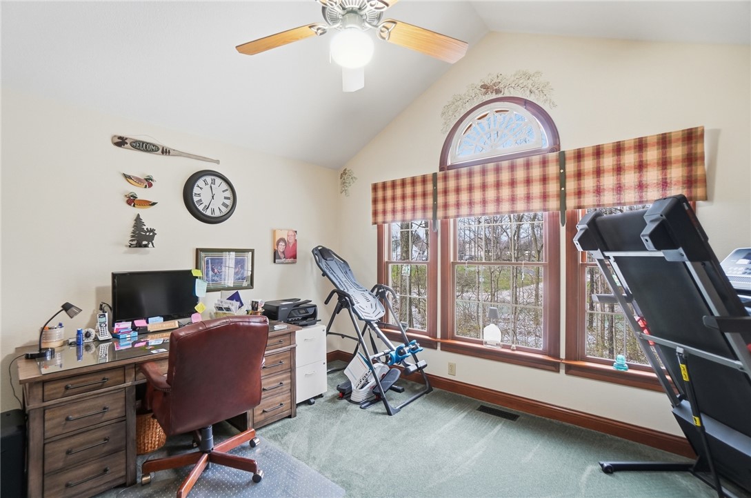 5300 Brookshire Lane Springfield, OH 45502 - Photo 37 of 56 This versatile room features vaulted ceilings, a ceiling fan, and large windows with scenic views.
