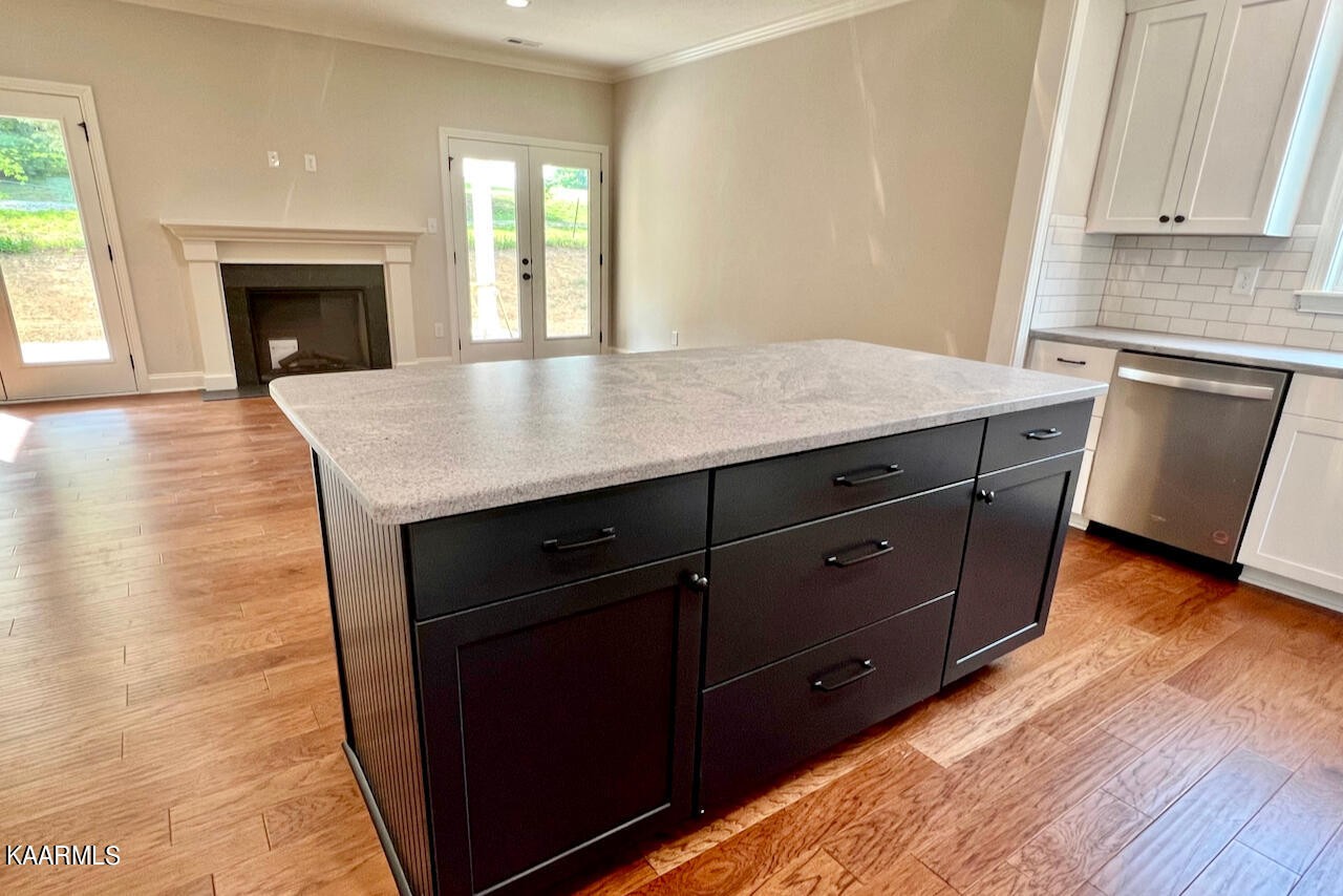 9356 Gabrielle Road Strawberry Plains, TN 37871 - Photo 13 of 39 a kitchen with granite countertop a stove a sink and a refrigerator