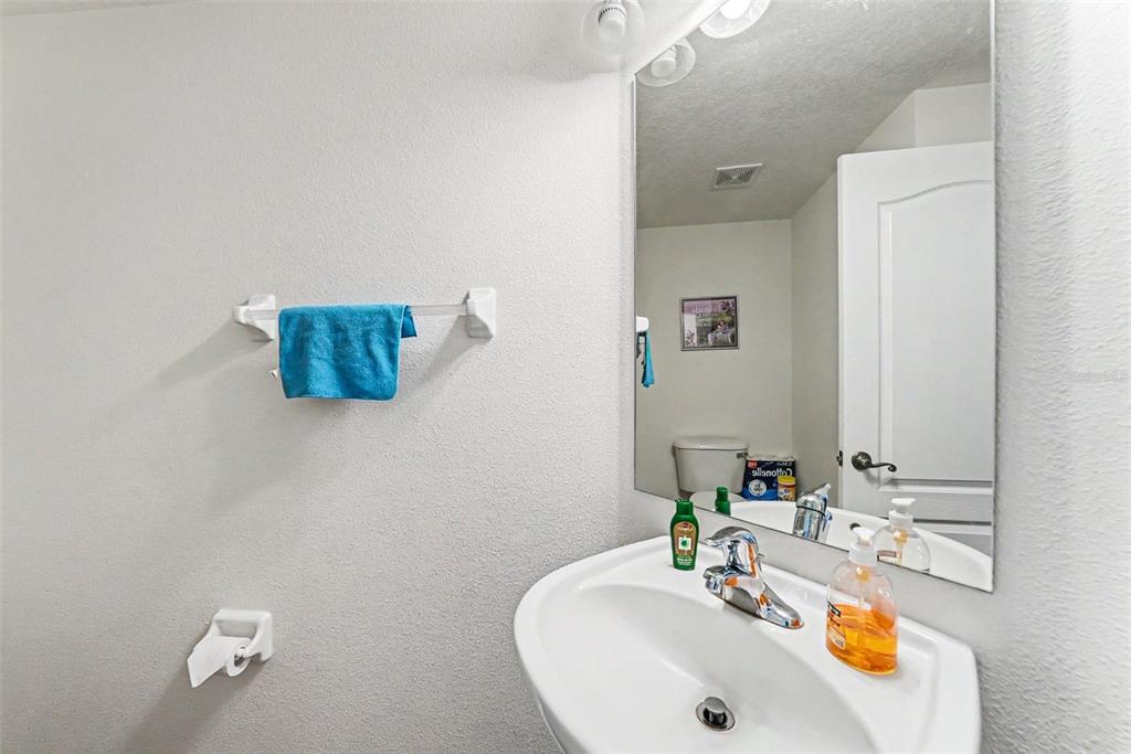 7411 Wimpole Drive New Port Richey, FL 34655 - Photo 7 of 21 a bathroom with a sink and a mirror