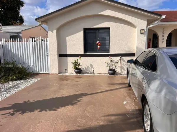 a view of kitchen with furniture and chandelier
