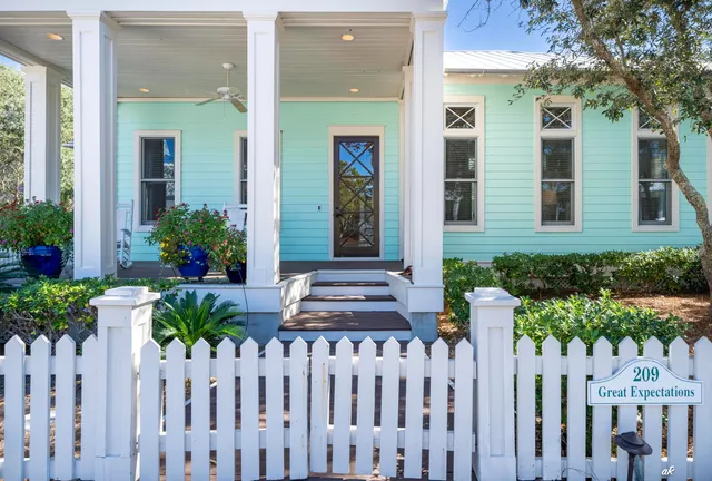 a view of a hallway with wooden floor and windows