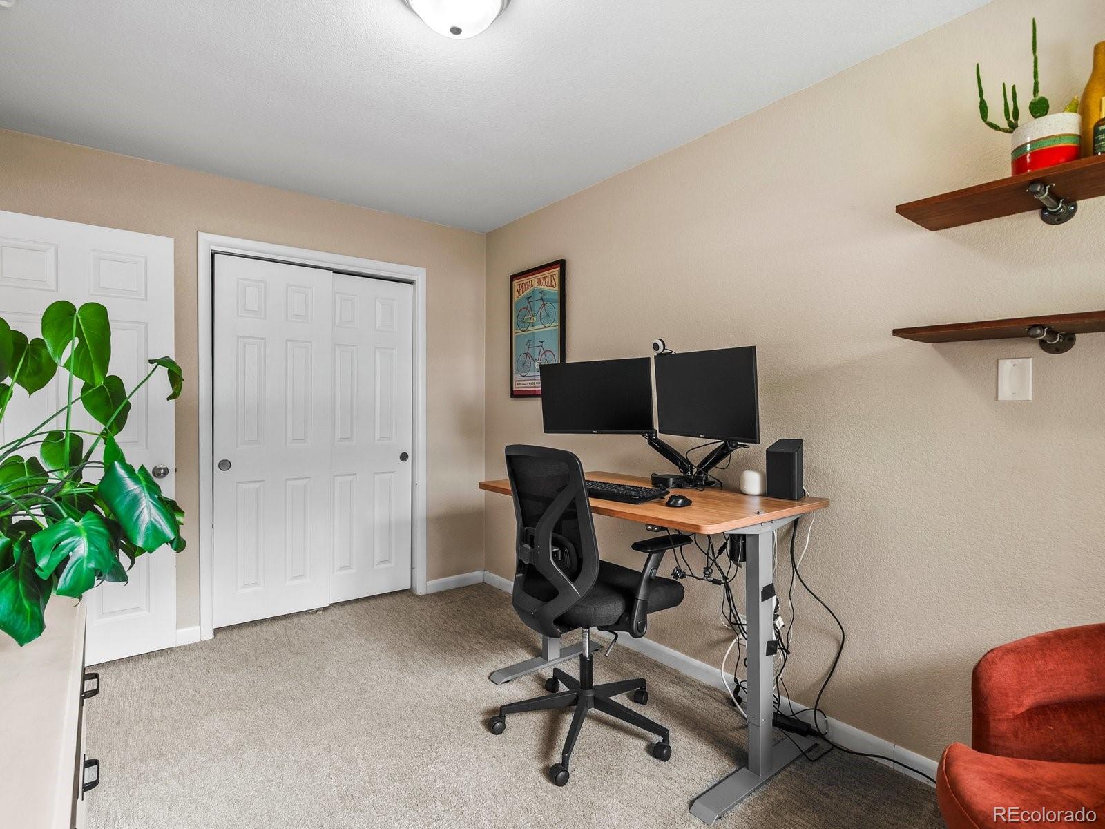 4963 North Harlan Street Wheat Ridge, CO 80033 - Photo 17 of 42 a view of a workspace with a couch