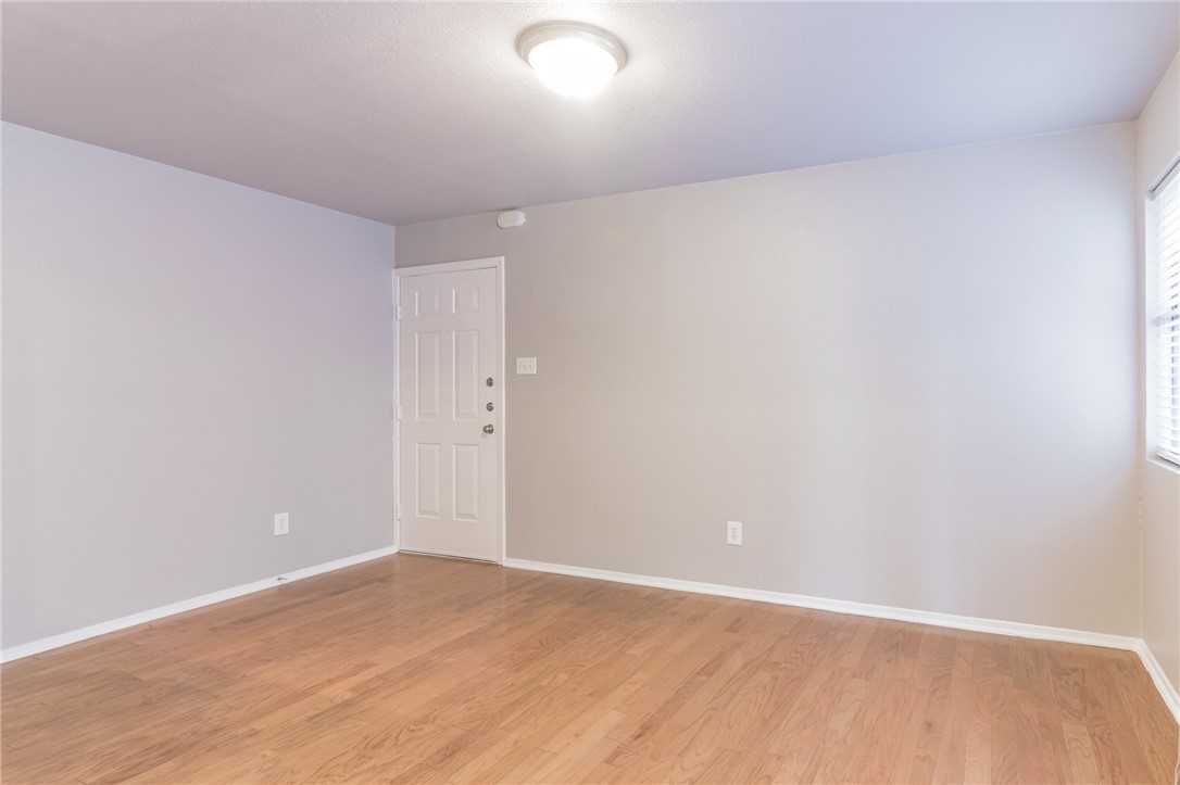 3627 Menchaca Road, Unit 112 Austin, TX 78704 - Photo 5 of 25 Living room taken from dining room. Front door in background.