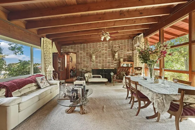 a bathroom with a sink a toilet and a shower curtain