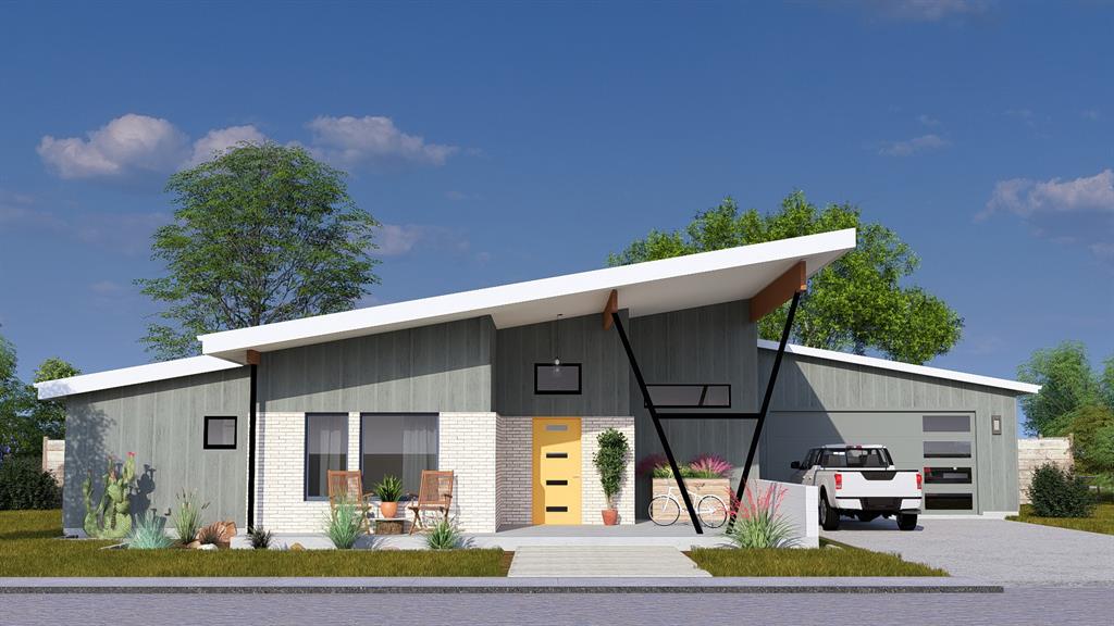 a view of a white house with large windows and a table and chairs