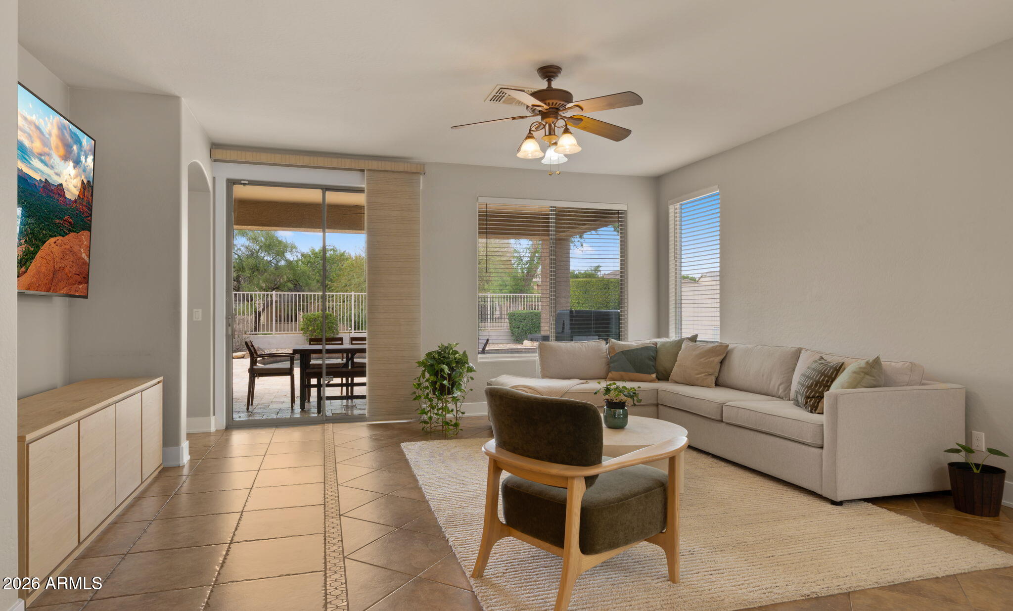 3344 East Hopkins Road Gilbert, AZ 85295 - Photo 10 of 32 a living room with furniture and a dining table