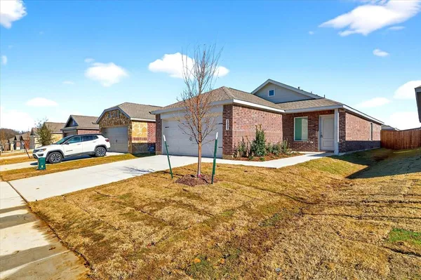 a view of a house with snow on the side of it