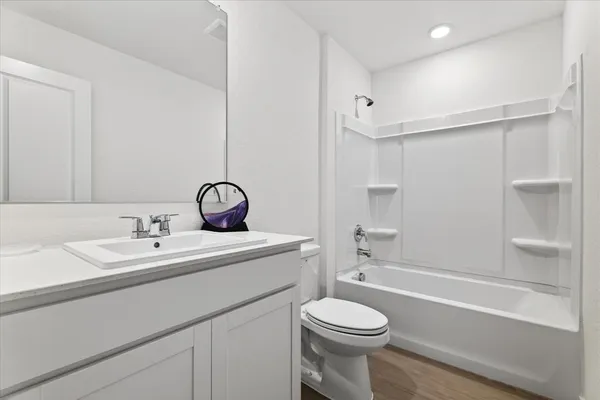 a bathroom with a sink a toilet and a bathtub