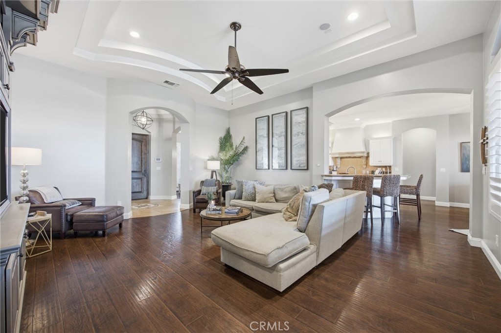 2103 Redmire Street Bakersfield, CA 93311 - Photo 16 of 53 a living room with furniture or wooden floor and a chandelier
