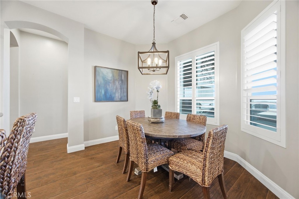 2103 Redmire Street Bakersfield, CA 93311 - Photo 19 of 53 a view of a dining room with furniture window and wooden floor