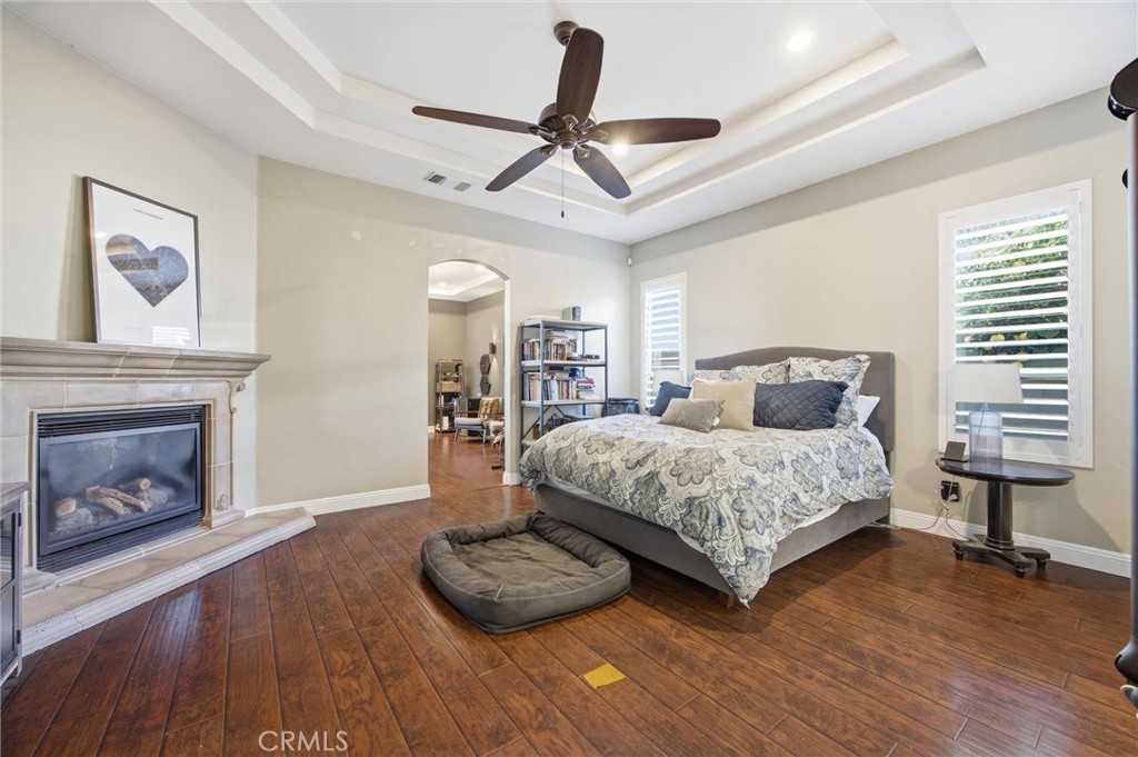 2103 Redmire Street Bakersfield, CA 93311 - Photo 26 of 53 a bedroom with a bed and a fireplace