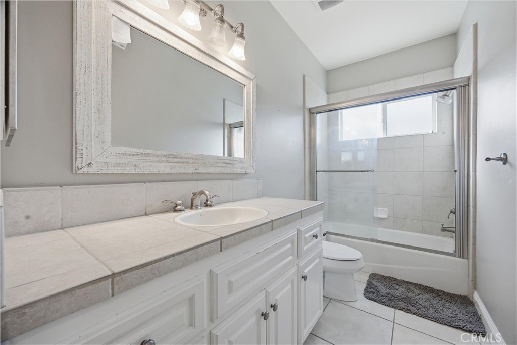 2103 Redmire Street Bakersfield, CA 93311 - Photo 35 of 53 a bathroom with a sink a toilet and shower