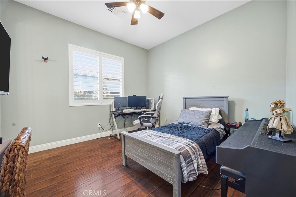 2103 Redmire Street Bakersfield, CA 93311 - Photo 36 of 53 a bed room with a bed and a desk