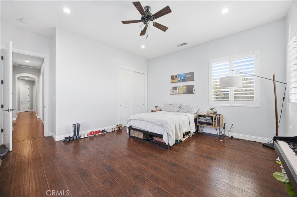2103 Redmire Street Bakersfield, CA 93311 - Photo 43 of 53 a bedroom with a bed and a table