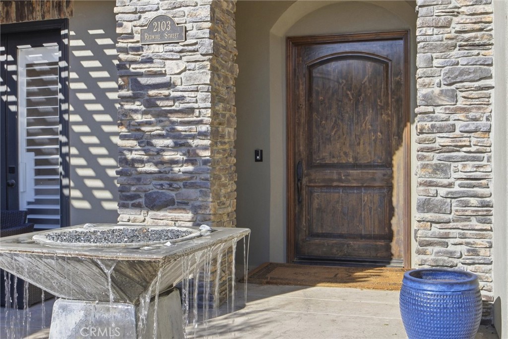 2103 Redmire Street Bakersfield, CA 93311 - Photo 7 of 53 a view of a wooden door and outdoor space