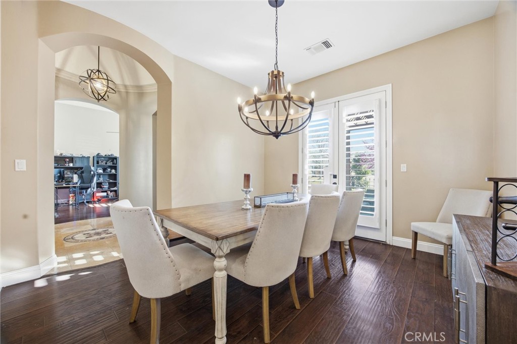 2103 Redmire Street Bakersfield, CA 93311 - Photo 10 of 53 a view of a dining room with furniture window and wooden floor
