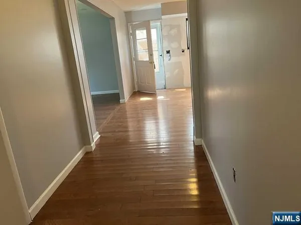 a kitchen with granite countertop stainless steel appliances a sink and a refrigerator