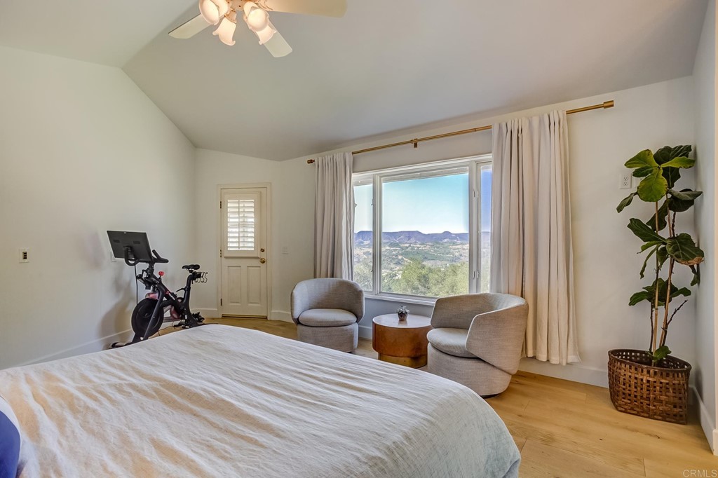 24596 Fuerte Road Temecula, CA 92590 - Photo 14 of 44 a bedroom with furniture and a large window