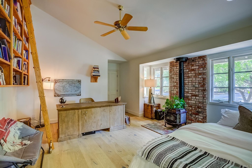 24596 Fuerte Road Temecula, CA 92590 - Photo 17 of 44 a bedroom with a bed couch and a large window