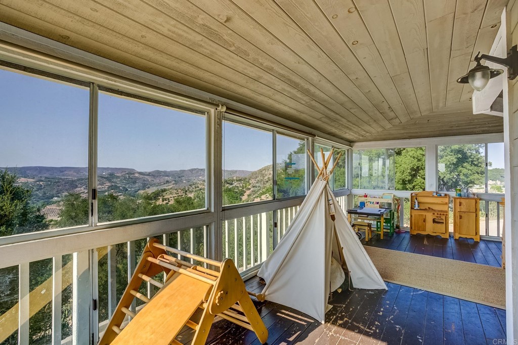 24596 Fuerte Road Temecula, CA 92590 - Photo 18 of 44 a view of a balcony with furniture and wooden floor