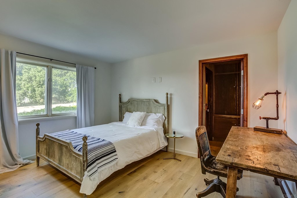 24596 Fuerte Road Temecula, CA 92590 - Photo 23 of 44 a bedroom with a bed and a table