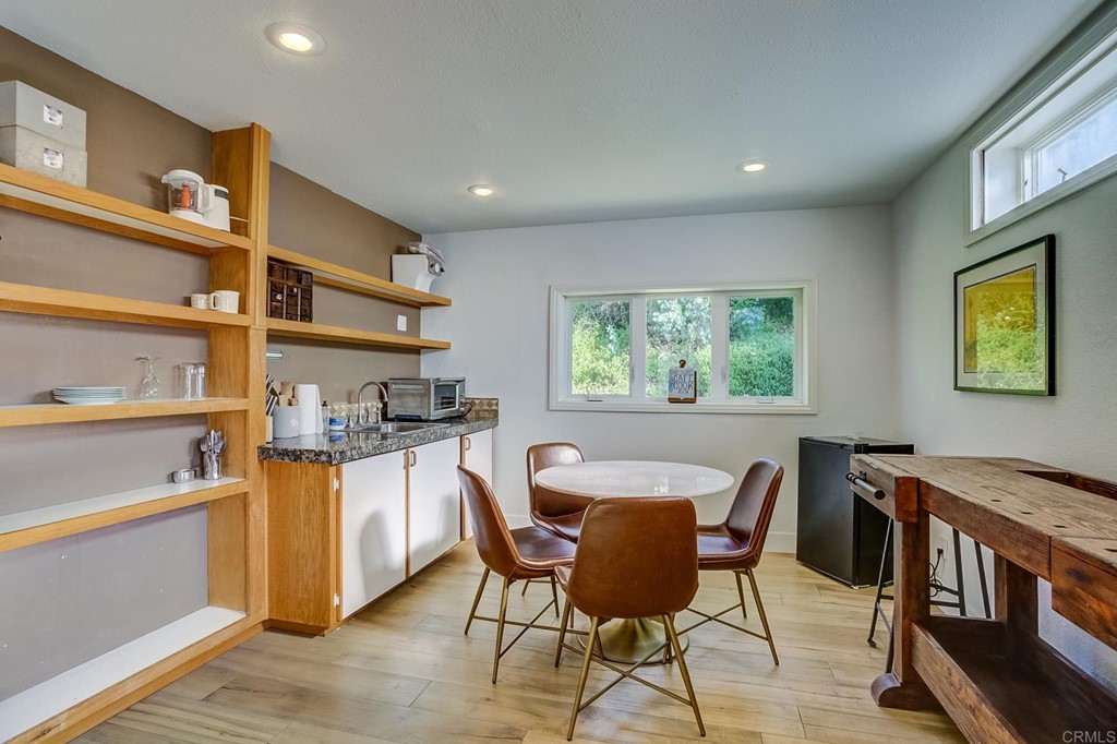 24596 Fuerte Road Temecula, CA 92590 - Photo 28 of 44 a view of a dining room with furniture and a window