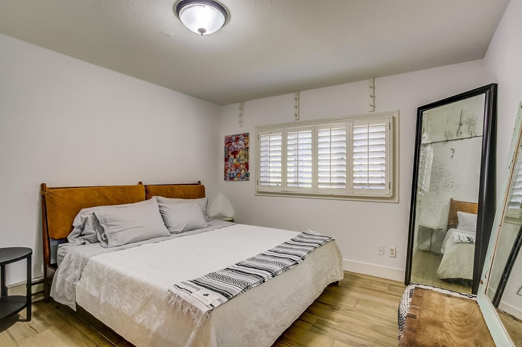24596 Fuerte Road Temecula, CA 92590 - Photo 29 of 44 a bedroom with a bed and a mirror