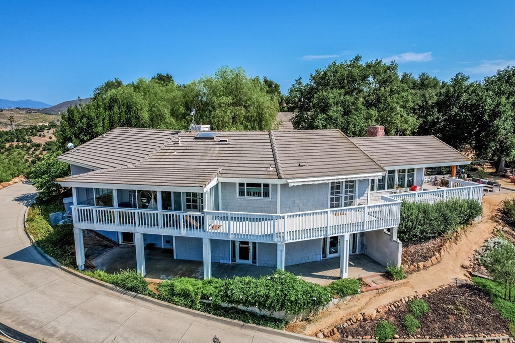 24596 Fuerte Road Temecula, CA 92590 - Photo 4 of 44 a aerial view of a house with a yard and potted plants