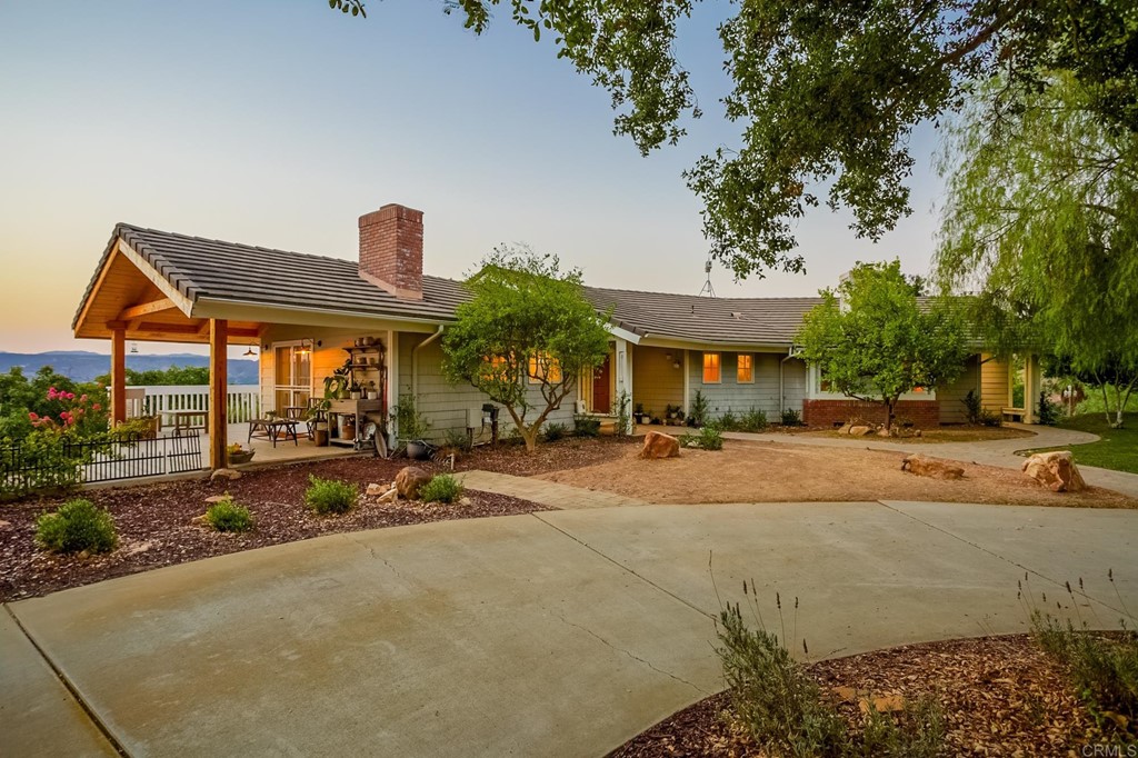 24596 Fuerte Road Temecula, CA 92590 - Photo 32 of 44 a row of palm trees in front of a house