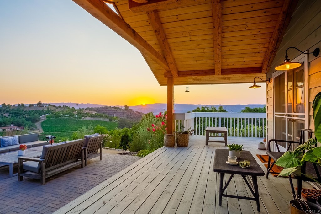 24596 Fuerte Road Temecula, CA 92590 - Photo 33 of 44 a view of a balcony with chairs and wooden floor