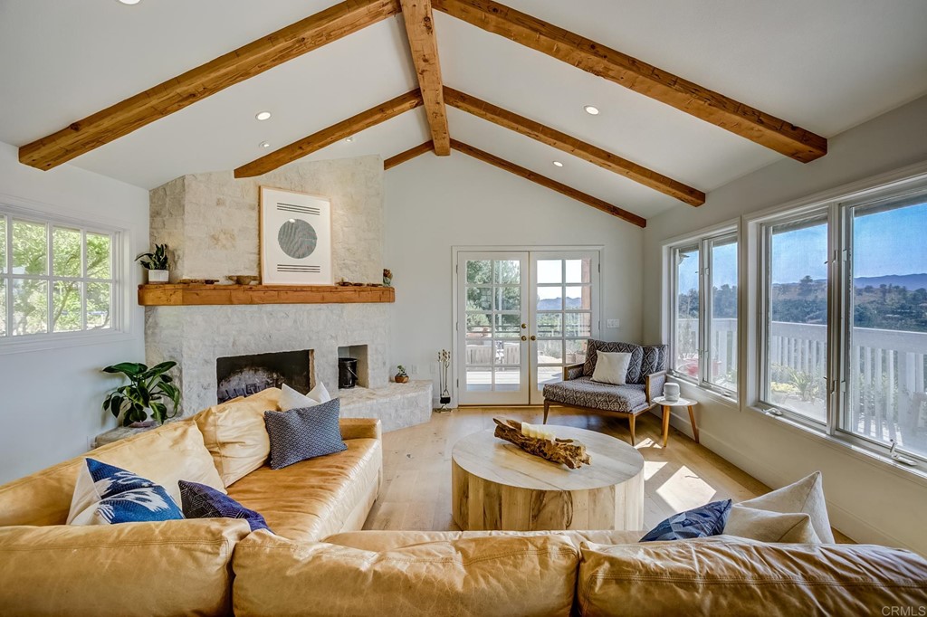 24596 Fuerte Road Temecula, CA 92590 - Photo 7 of 44 a living room with furniture fireplace and a large window