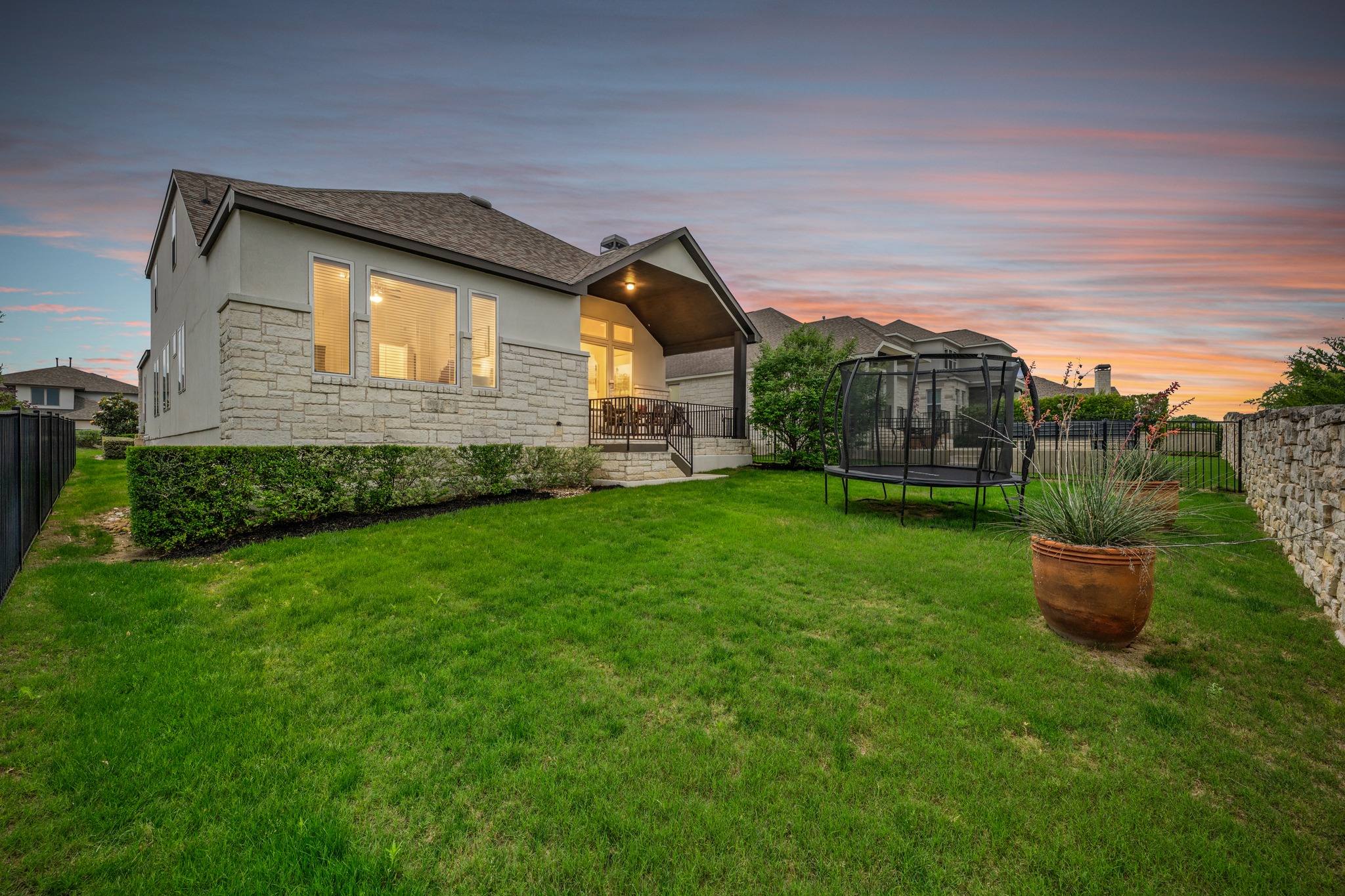 510 Elworth Path Austin, TX 78738 - Photo 2 of 40 a house view with a garden space