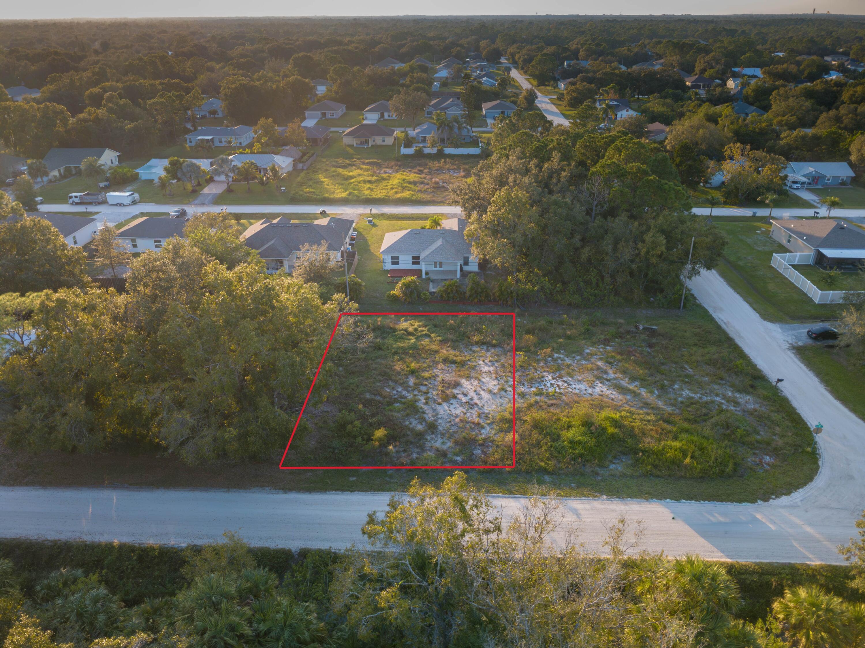 8977 100th Avenue Vero Beach, FL 32967 - Photo 6 of 6 an aerial view of a residential houses with outdoor space