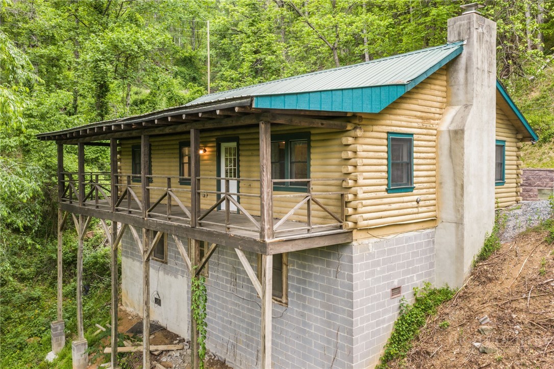 233 Alpine Acres Road Vilas, NC 28692 - Photo 30 of 32 a view of a small house with roof deck