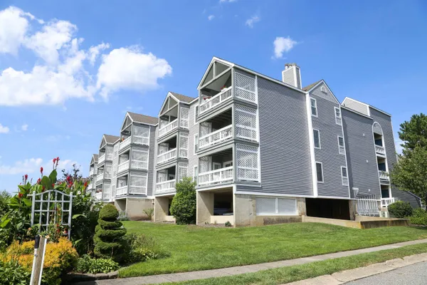 a front view of building with yard
