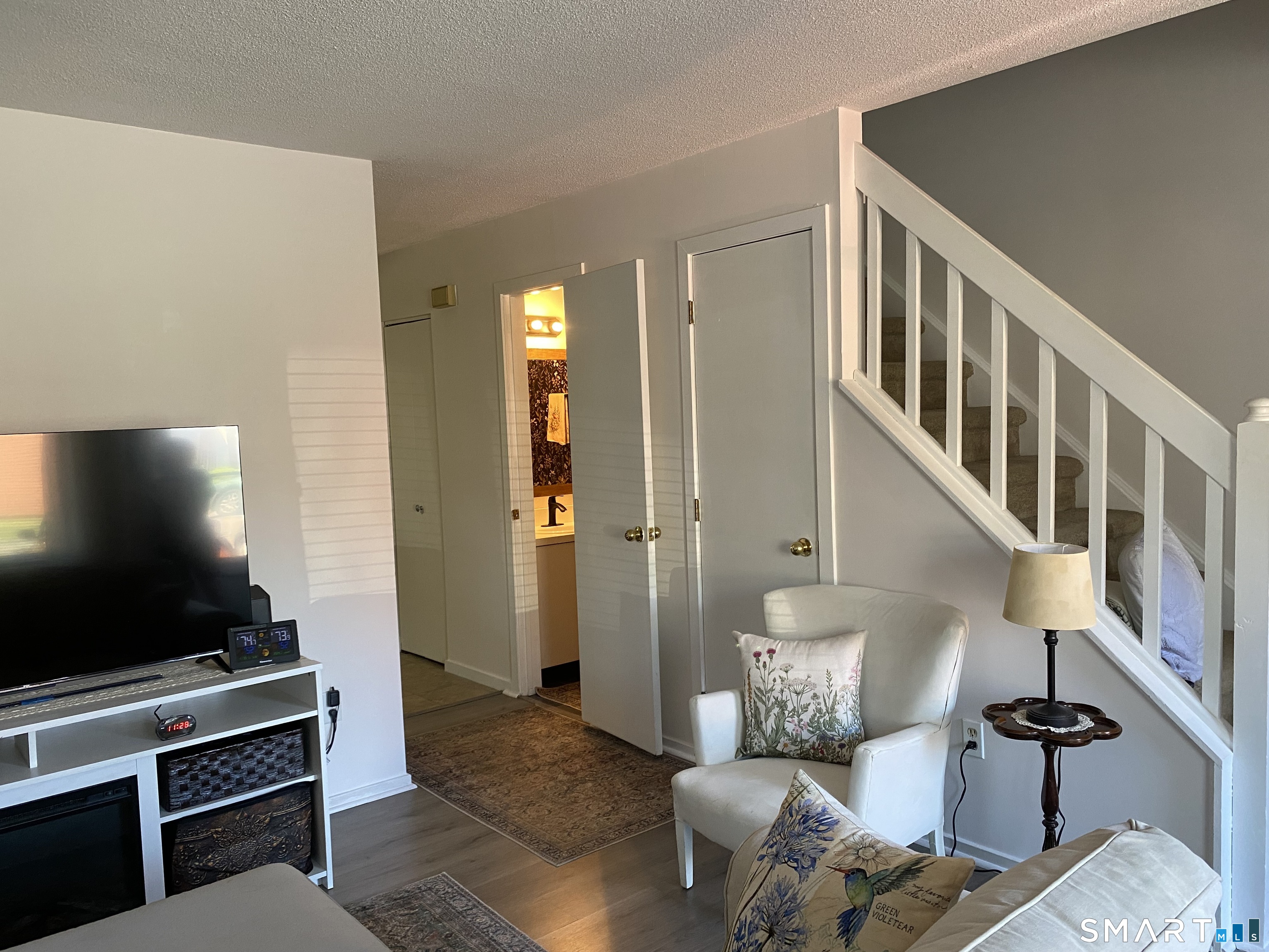 585 Park Road, Unit 58 Waterbury, CT 06708 - Photo 6 of 23 Living room with stairs leading to second level