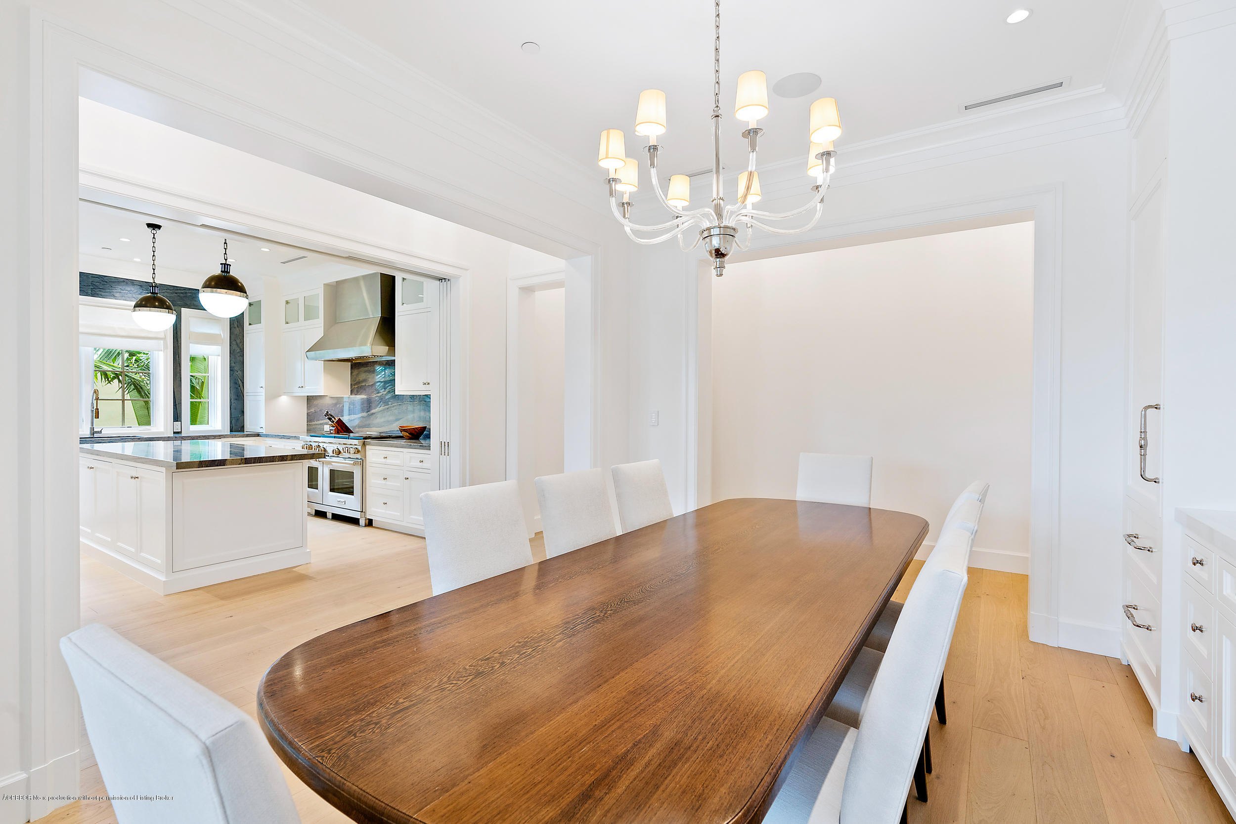 3 Via Flagler Palm Beach, FL 33480 - Photo 14 of 42 a living room with kitchen island furniture and a chandelier