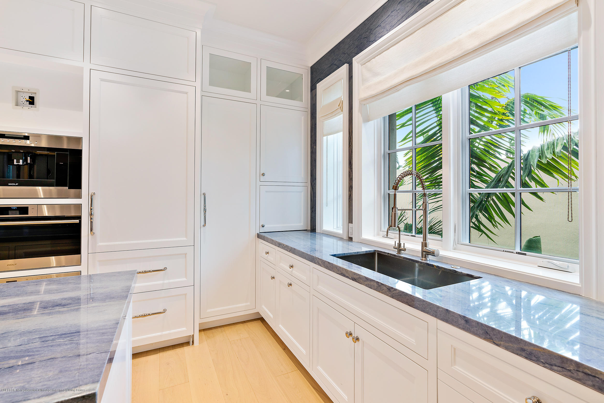 3 Via Flagler Palm Beach, FL 33480 - Photo 17 of 42 a kitchen with granite countertop a sink and a window