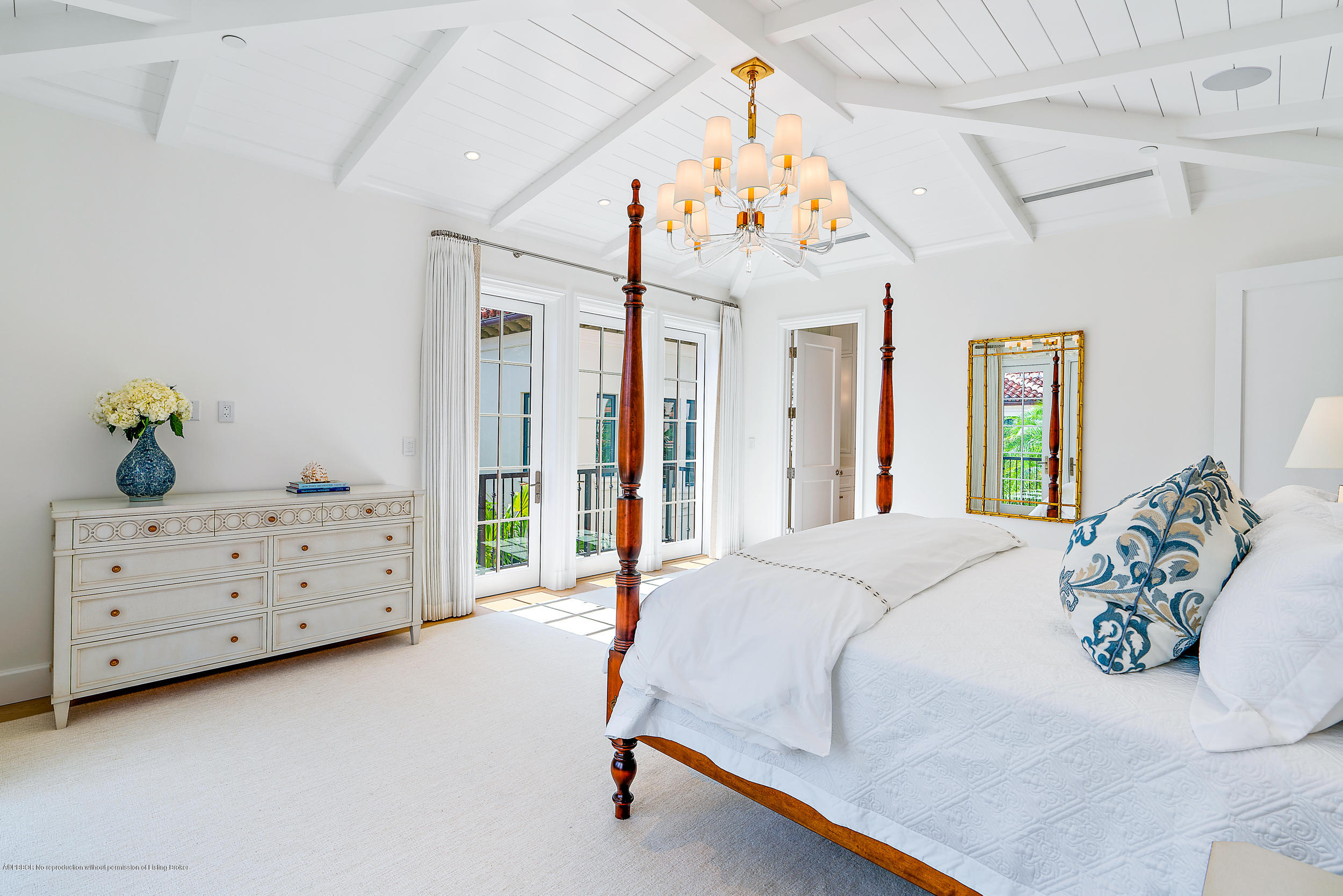 3 Via Flagler Palm Beach, FL 33480 - Photo 22 of 42 a bedroom with a bed and a chandelier